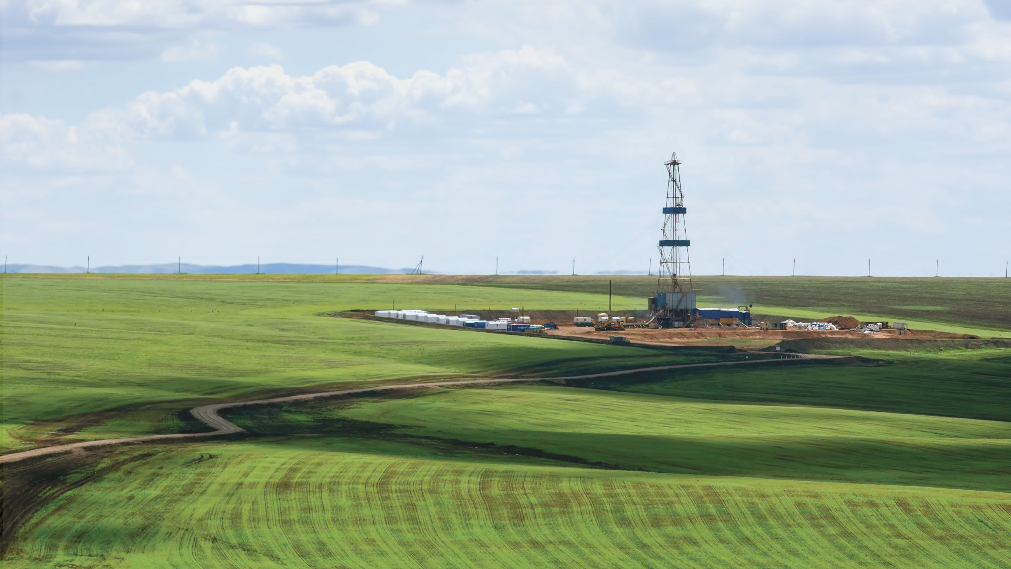 Kansas rolling hill with drilling site